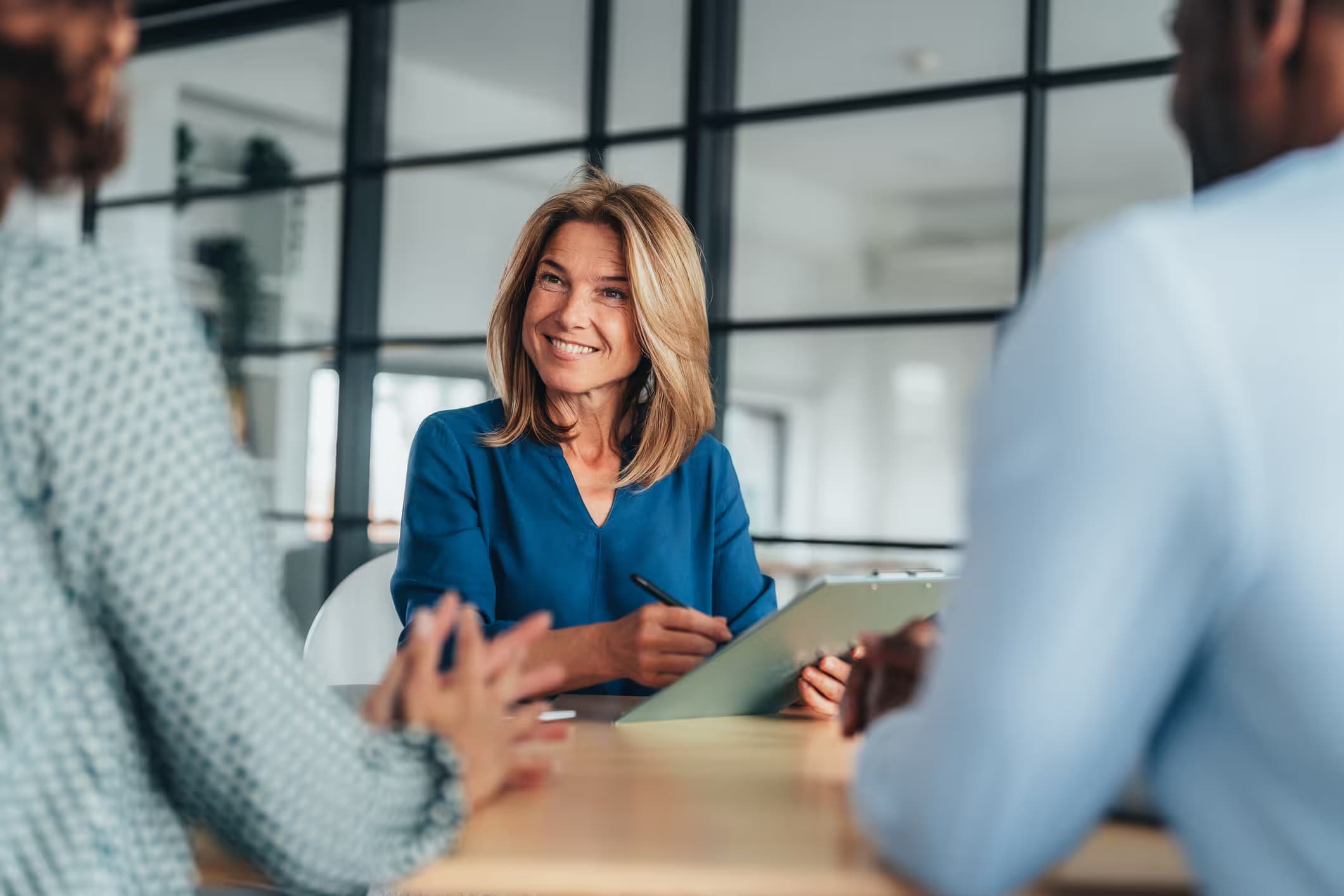 A Nathan HR consultant meeting with two clients