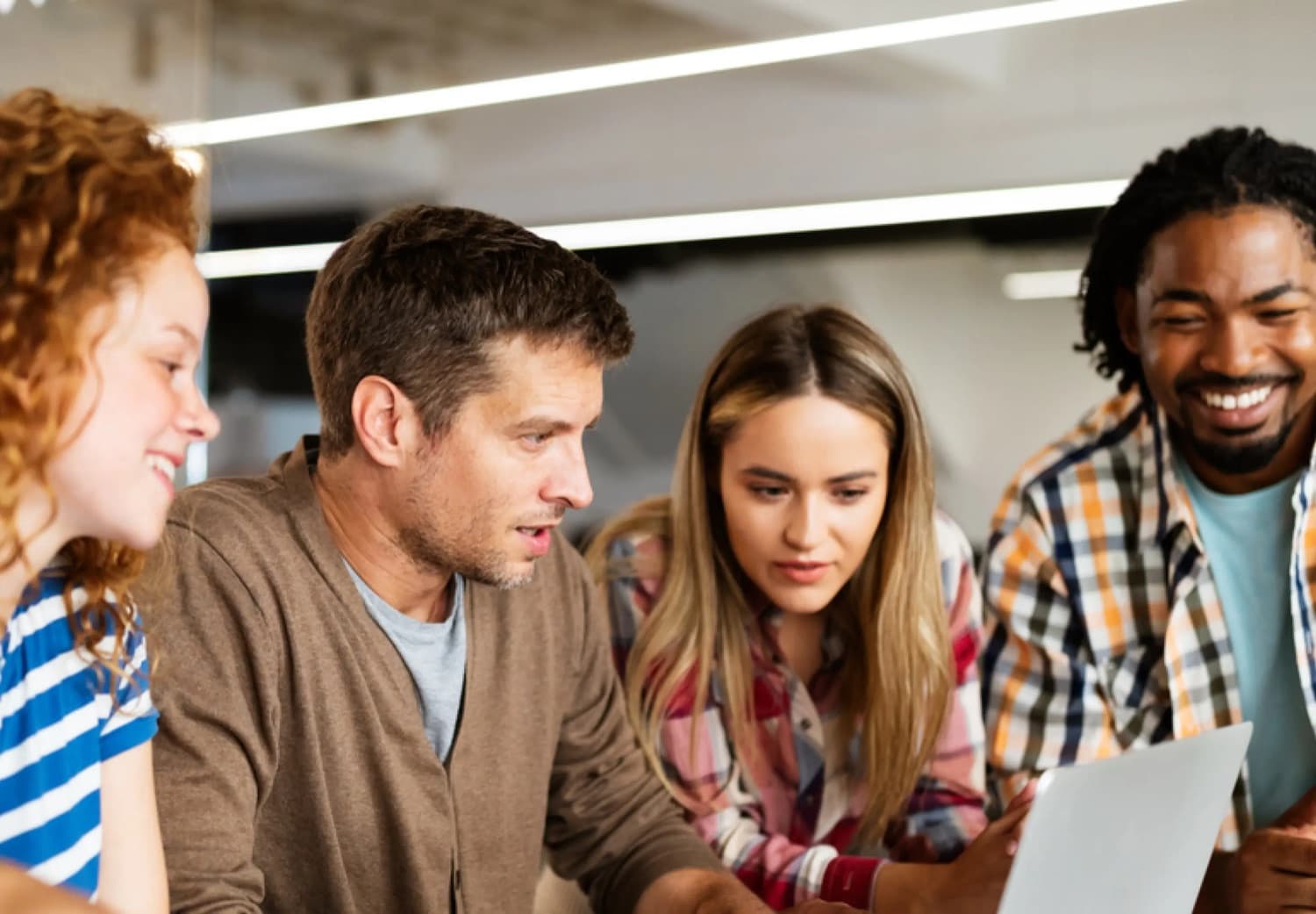 HR team collaborating at a laptop